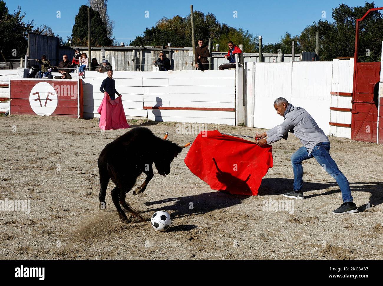 A toreador teacher of the Arles bullfighting school plays with a soccer ball during a bullfight show at the Monumental de Gimeaux arena in Arles, France, November 20, 2022.  REUTERS/Eric Gaillard Stock Photo