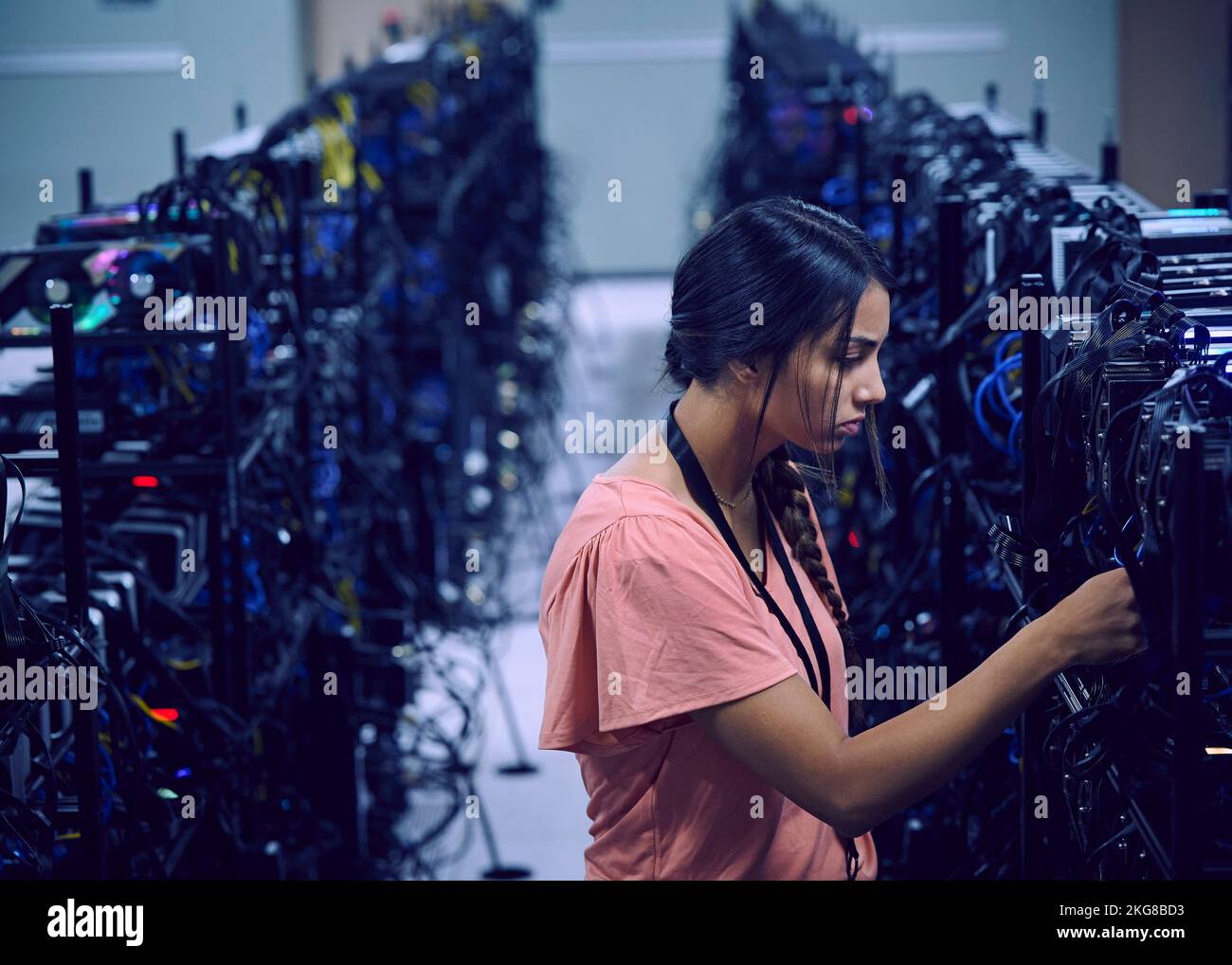 Female technician working in server room Stock Photo - Alamy