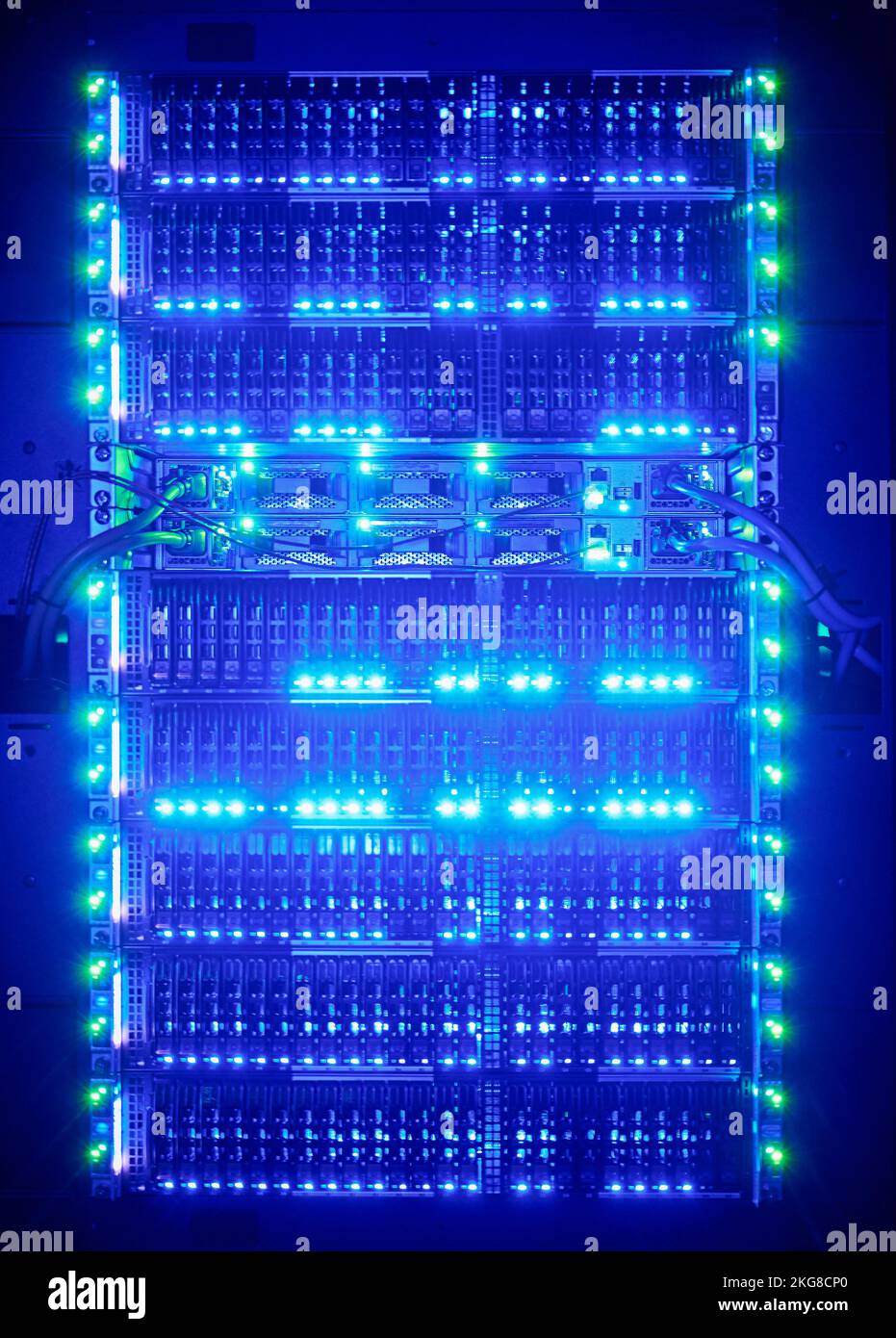 Illuminated network cables in server room Stock Photo