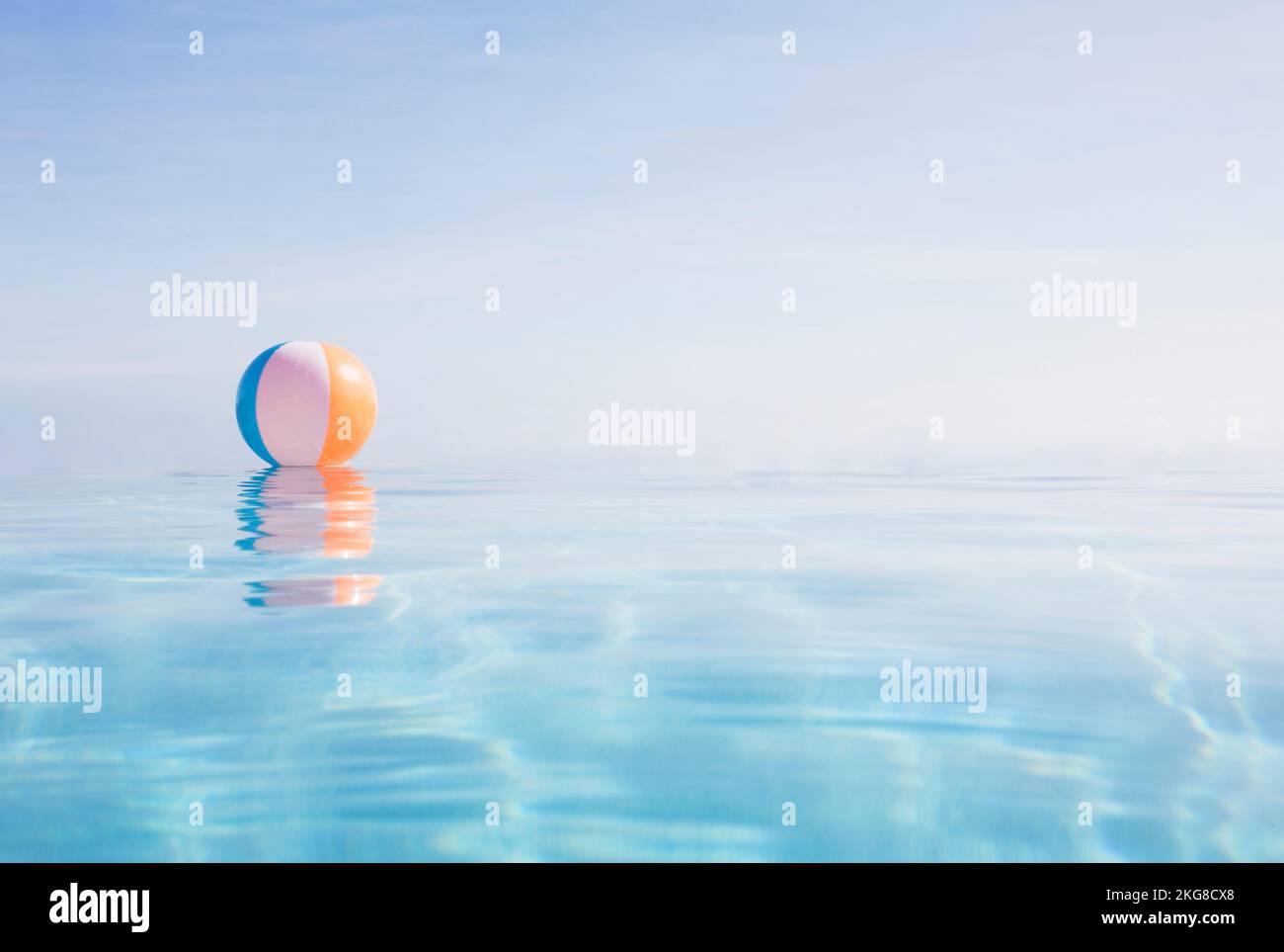 Beach ball floating on water surface Stock Photo Alamy