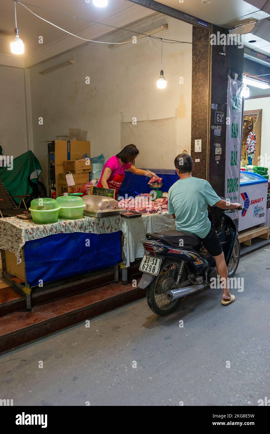 A Vietnamese Street Butcher in the backstreets of Hanoi, Vietnam Stock