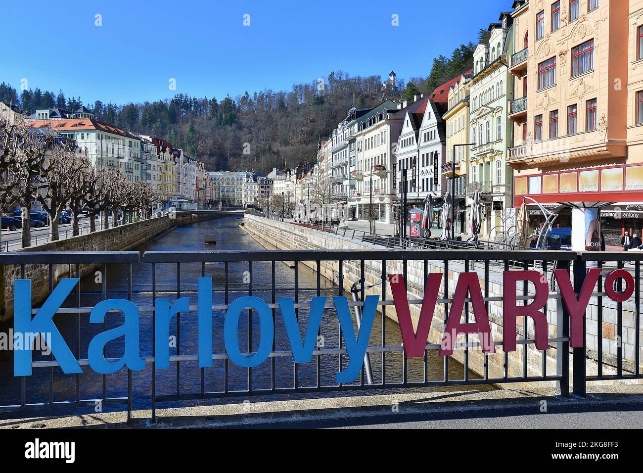 The embankment of the Tepla River with spa houses in the centre of Karlovy Vary. The Karlovy Vary sign on the Jansky Bridge.  (CTK Photo/Petr Svancara Stock Photo