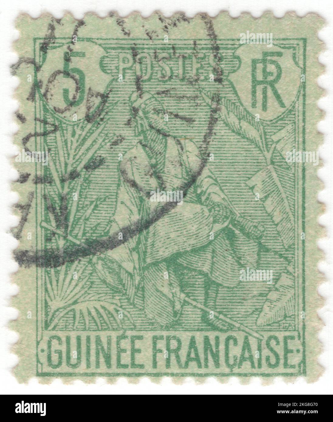 FRENCH GUINEA - 1904: An 5 centimes green on greenish postage stamp depicting Fulah Shepherd. The Fula, Fulani, or Fulah people are one of the largest ethnic groups in the Sahel and West Africa, widely dispersed across the region. Inhabiting many countries, they live mainly in West Africa and northern parts of Central Africa, South Sudan, Darfur, and regions near the Red Sea coast in Sudan. The approximate number of Fula people is unknown due to clashing definitions regarding Fula ethnicity. Various estimates put the figure between 25 and 40 million people worldwide Stock Photo