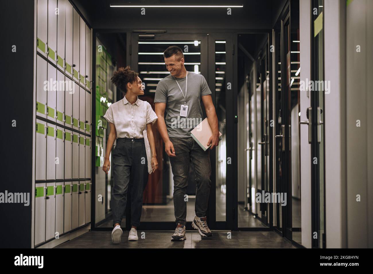 Joyful employees having a conversation on the go Stock Photo