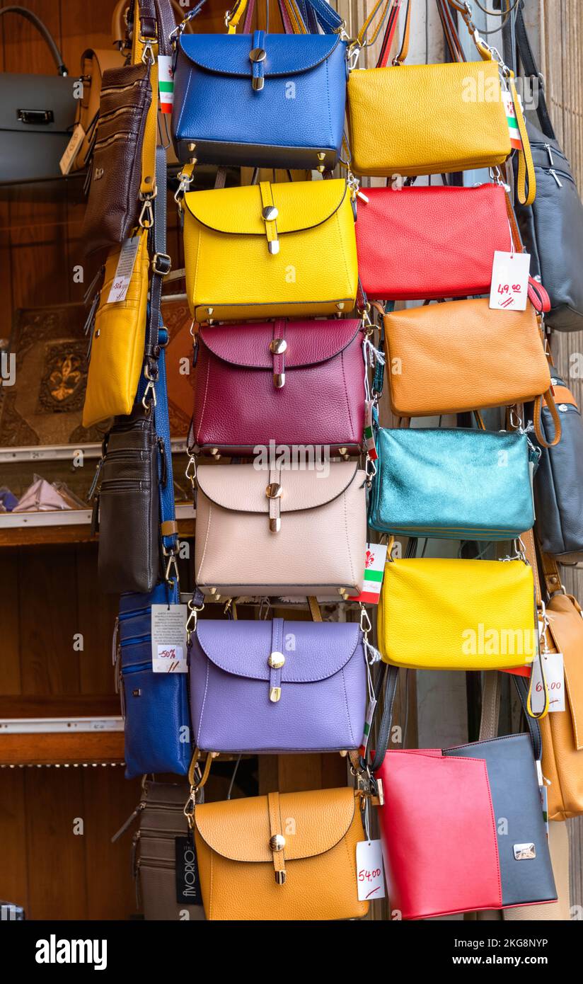 Different kind of leather purse bags colorful vibrant colors selling in the  Italian market shop Stock Photo by ©olena.sakhatska 289501334