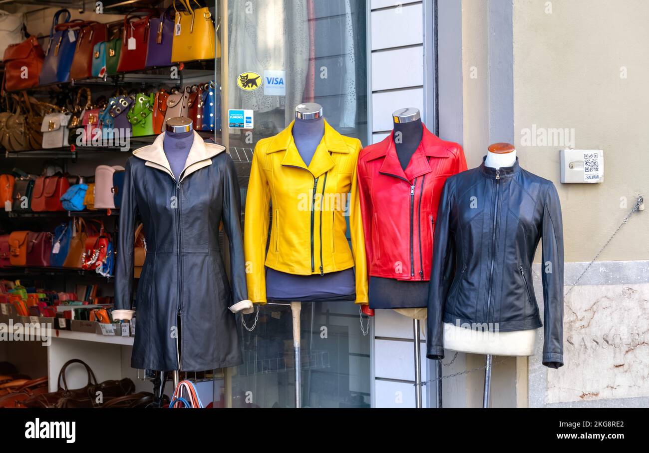 Yellow red and black Italian leather jackets on mannequins outside a shop  in Florence, Italy Stock Photo