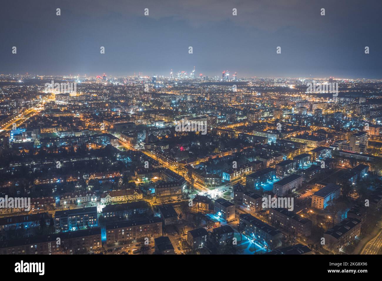 Warsaw by night, aerial landscape of illuminated streets and buildings Stock Photo