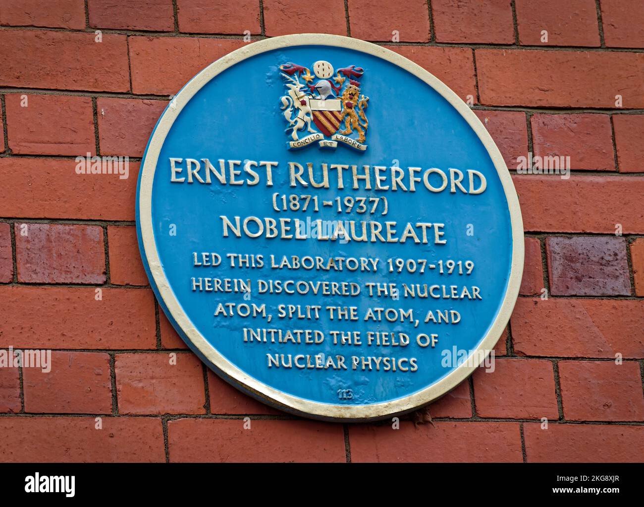 Blue Plate in Manchester University's Coupland Street celebrating work carried out there by Ernest Rutherford,splitting the Atom and Nuclear Physics. Stock Photo