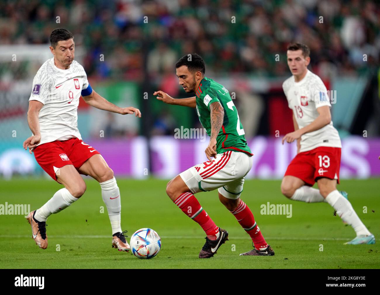 Jeremie FRIMPONG (Bayer 04 Leverkusen, #30) in a duel with Jakub KAMINSKI  (VfL Wolfsburg, #16), Stock Photo, Picture And Rights Managed Image. Pic.  PAH-321123917