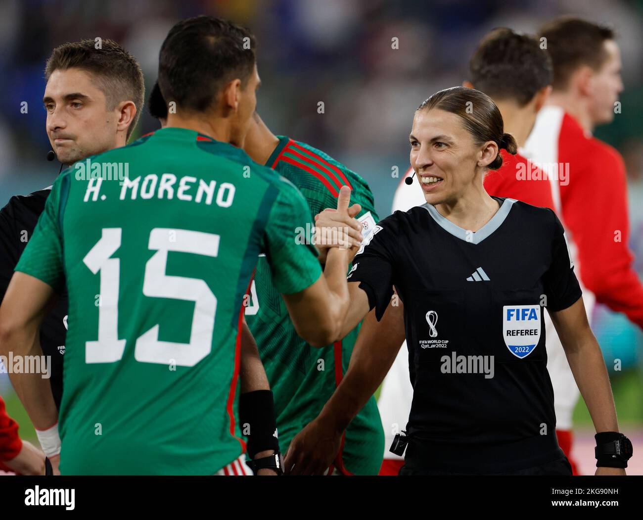 Doha, Qatar. 22nd Nov, 2022. The 4th official Stephanie Frappart (R) reacts with Hector Moreno of Mexico prior to the Group C match between Mexico and Poland of the 2022 FIFA World Cup at Ras Abu Aboud (974) Stadium in Doha, Qatar, Nov. 22, 2022. Credit: Wang Lili/Xinhua/Alamy Live News Stock Photo
