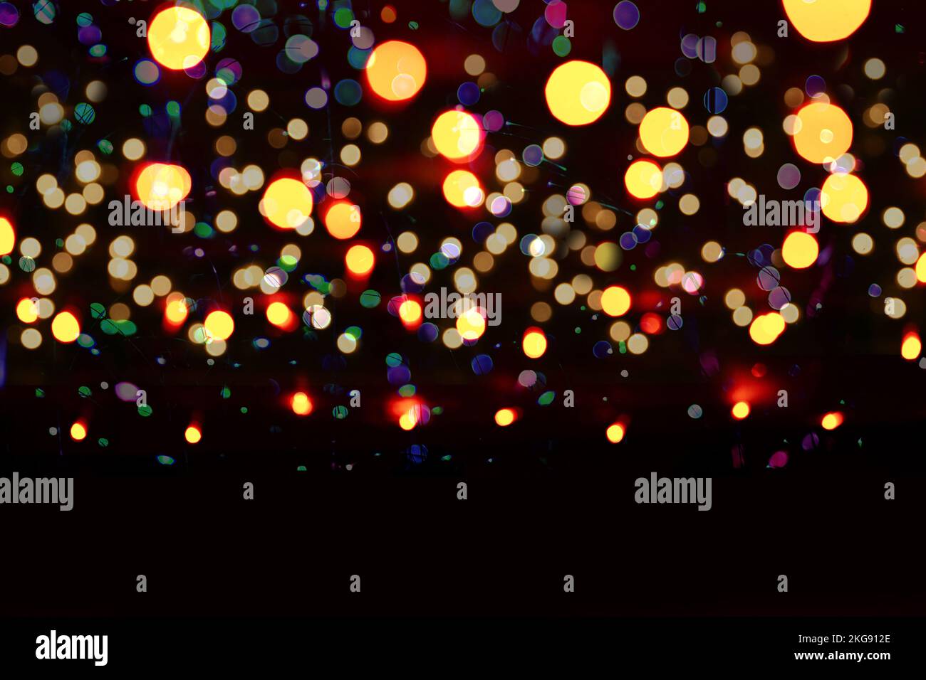 Blurred city festive lighting, illumination, abstract bokeh background. Christmas backdrop for poster Stock Photo