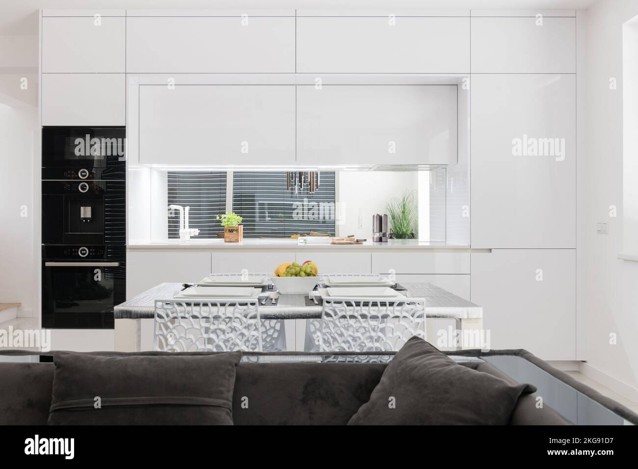 White kitchen with built in appliances in modern apartment Stock Photo ...