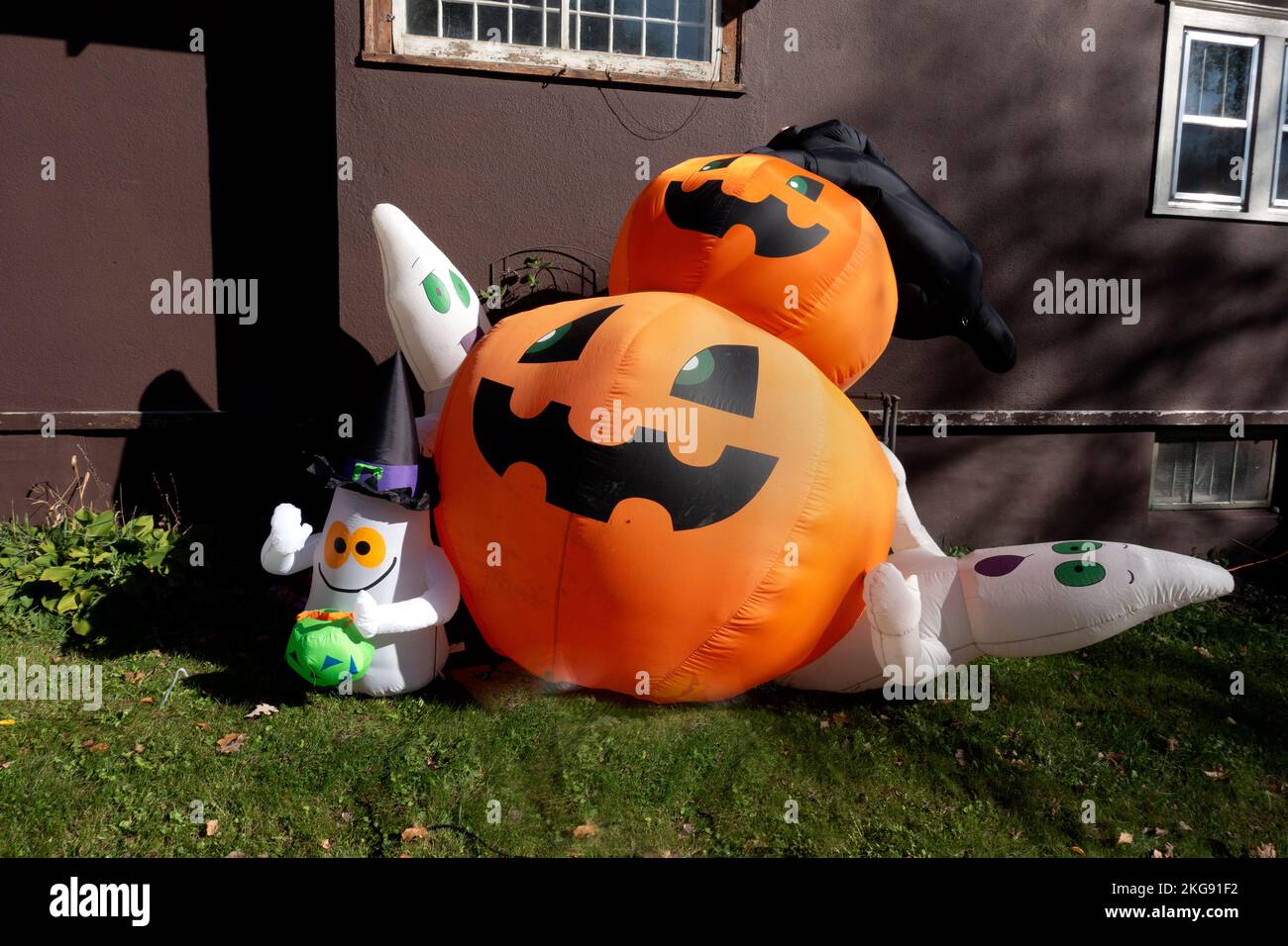 Blow-up pumpkins and ghost decorations for Halloween festivities. Blow up pumpkins and ghost decorations for Halloween festivities. Fergus Falls Minnesota MN USA Stock Photo