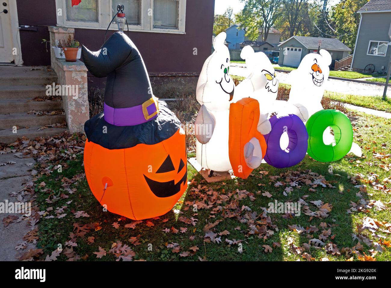 Diabolic group of blow-up ghosts and jack-o'-lantern Halloween decorations. Fergus Falls Minnesota MN USA Stock Photo