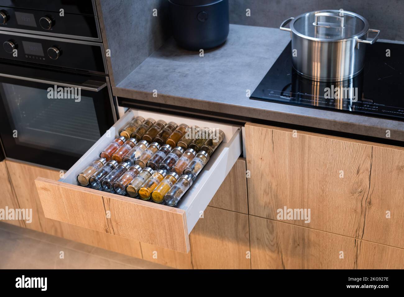 Kitchen drawer with glasses of herbs and spices Stock Photo Alamy