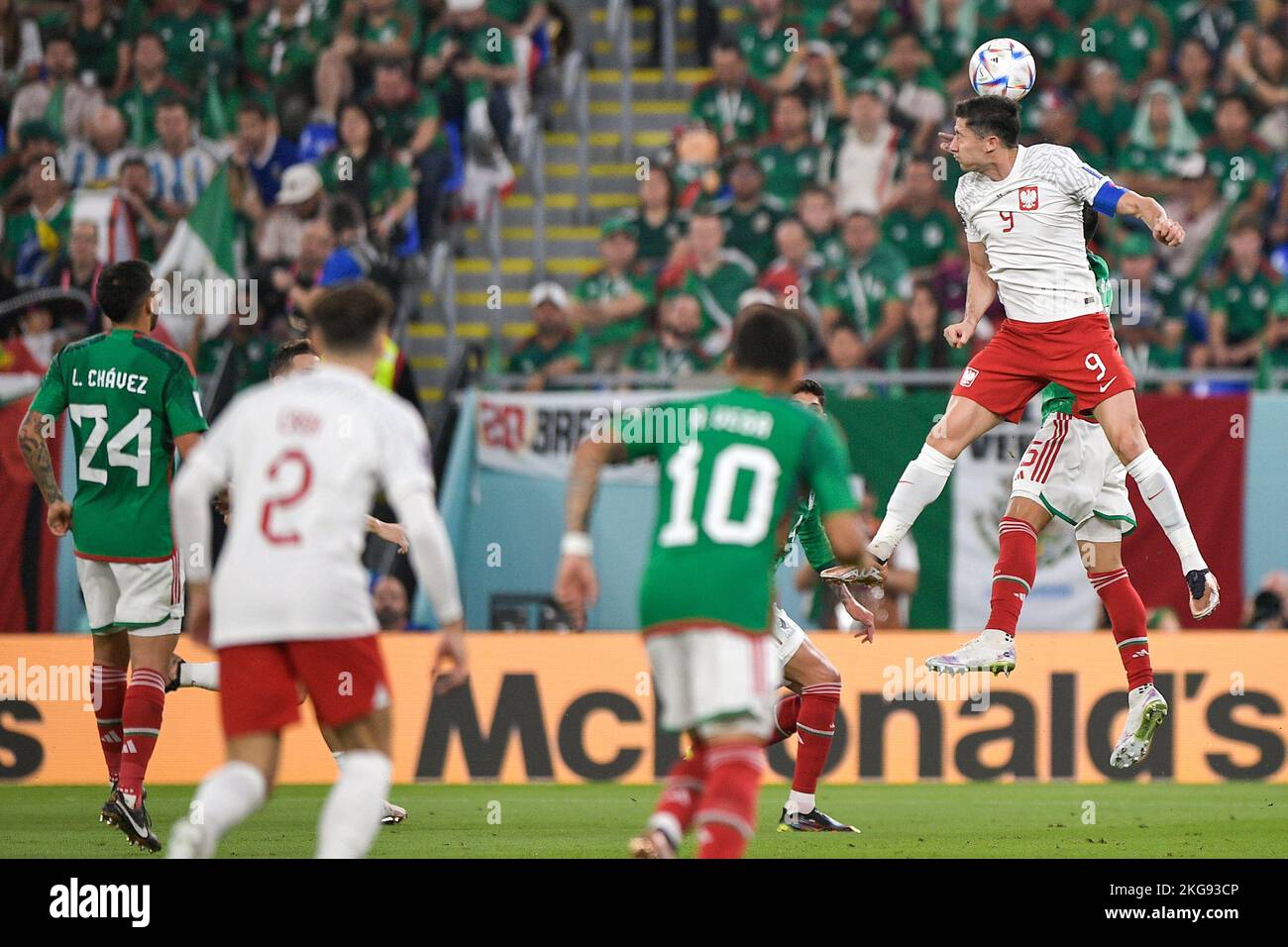 DOHA, QATAR - NOVEMBER 22: Robert Lewandowski of Poland wins a defensive header against Hector Moreno of Mexico during the Group C - FIFA World Cup Qatar 2022 match between Mexico and Poland at Stadium 974 on November 22, 2022 in Doha, Qatar (Photo by Pablo Morano/BSR Agency) Credit: BSR Agency/Alamy Live News Stock Photo