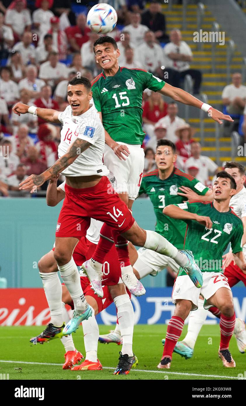Doha, Qatar. 22nd Nov, 2022. Jakub Kiwior (L, front) of Poland vies with Hector Moreno of Mexico during the Group C match between Mexico and Poland of the 2022 FIFA World Cup at Ras Abu Aboud (974) Stadium in Doha, Qatar, Nov. 22, 2022. Credit: Chen Cheng/Xinhua/Alamy Live News Stock Photo