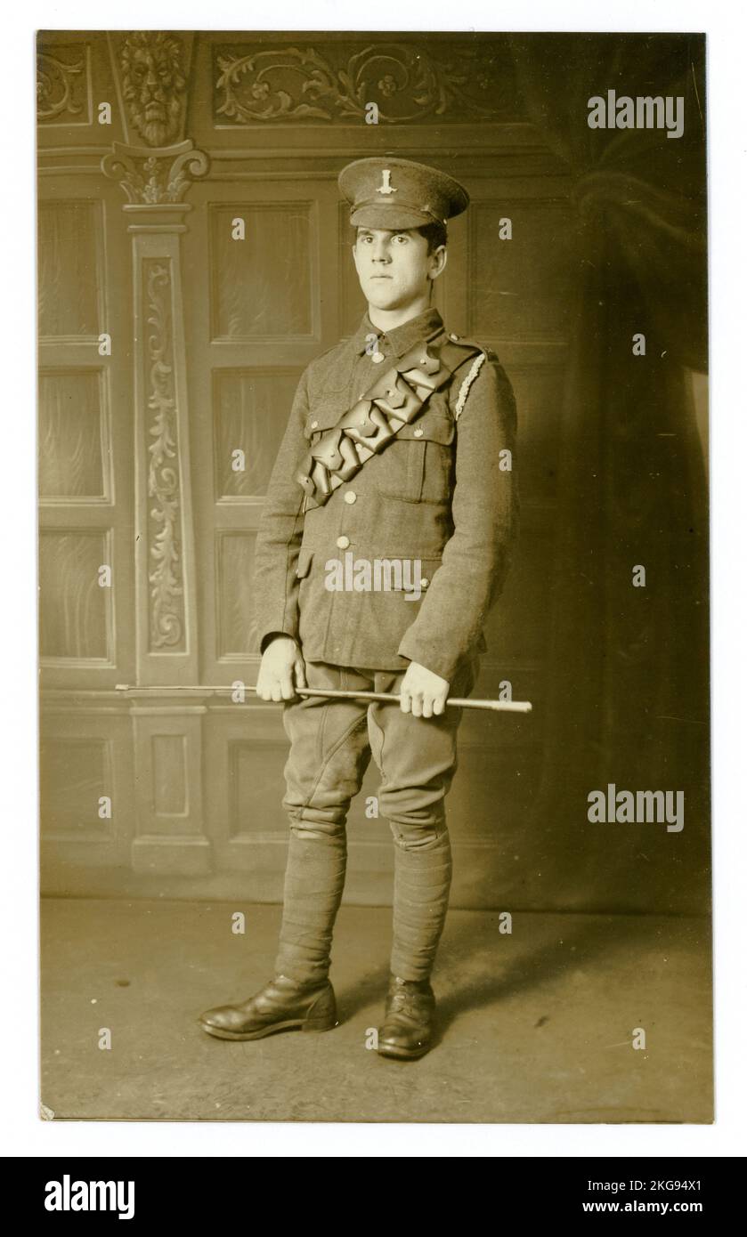 Original WW1 era postcard of cavalryman of the 11th Hussars, (Prince Albert's Own also  known as the Cherry Pickers) posing for a studio portrait photograph in his uniform near Aldershot military training camp. The young man's name is Arthur Darling from Norwich, Norfolk. This was taken just before the 11th Hussars were due to be transferred elsewhere, (possibly to York), later they may have been sent to join the battle at Messines) as infantry, not the cavalry. Location: Aldershot, Hampshire, England, UK. Circa 1914. Stock Photo