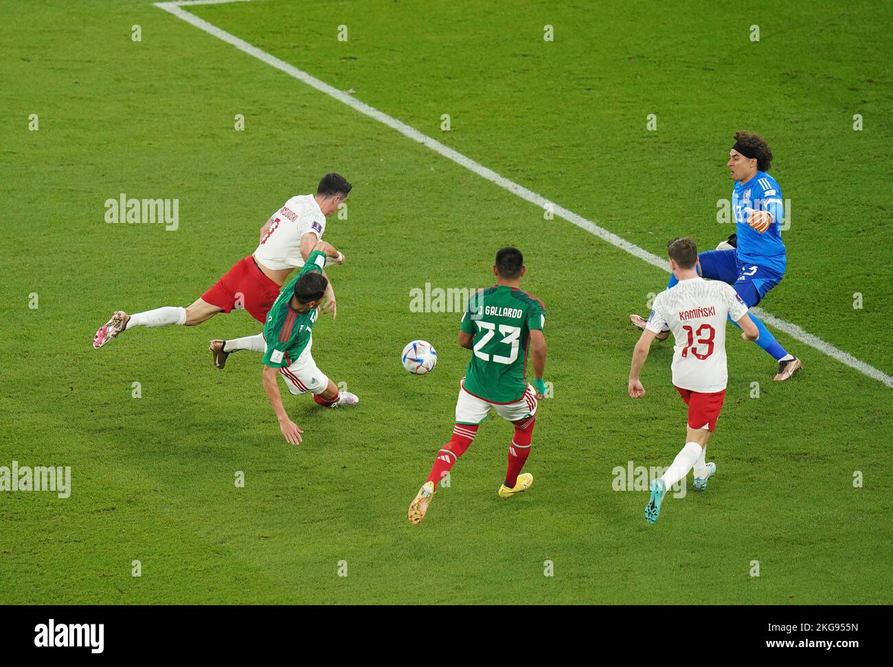 Mexico's Hector Moreno fouls Poland's Robert Lewandowski, resulting in a penalty during the FIFA World Cup Group C match at Stadium 974, Rass Abou Aboud. Picture date: Tuesday November 22, 2022. Stock Photo