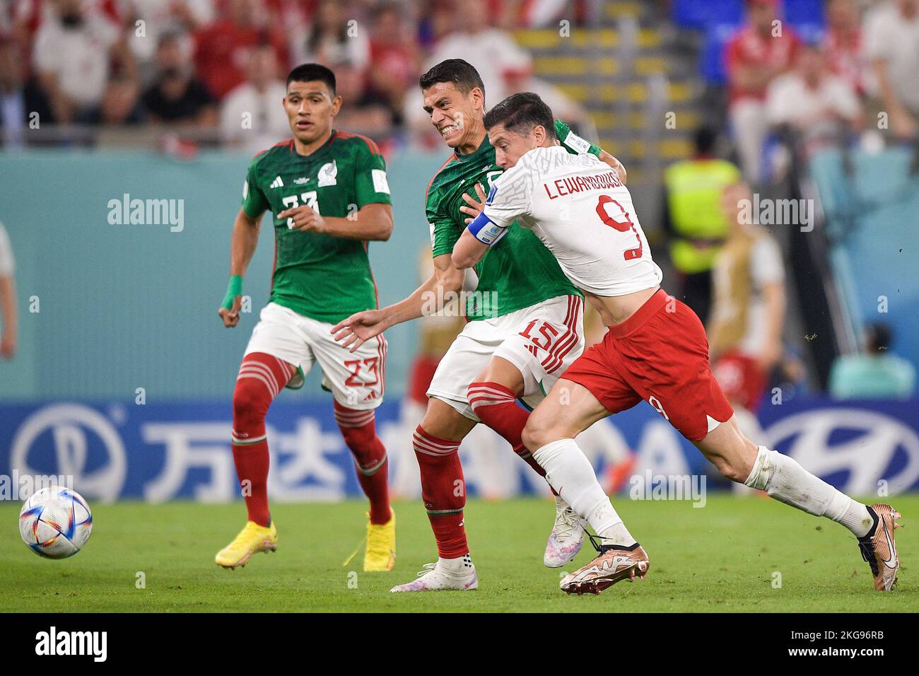 DOHA, QATAR - NOVEMBER 22: Hector Moreno of Mexico battles for the ball with Robert Lewandowski of Poland during the Group C - FIFA World Cup Qatar 2022 match between Mexico and Poland at Stadium 974 on November 22, 2022 in Doha, Qatar (Photo by Pablo Morano/BSR Agency) Credit: BSR Agency/Alamy Live News Stock Photo