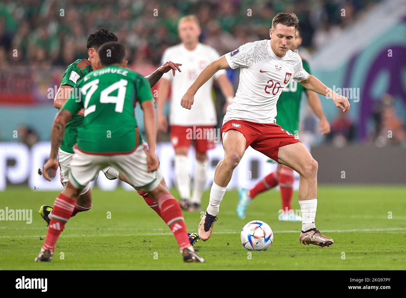 DOHA, QATAR - NOVEMBER 22: Hector Moreno of Mexico battles for the ball with Piotr Zielinski of Poland during the Group C - FIFA World Cup Qatar 2022 match between Mexico and Poland at Stadium 974 on November 22, 2022 in Doha, Qatar (Photo by Pablo Morano/BSR Agency) Stock Photo