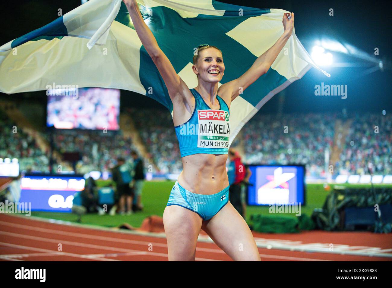 kristiina-m-kel-with-her-country-s-flag-of-the-triple-jump-at-the
