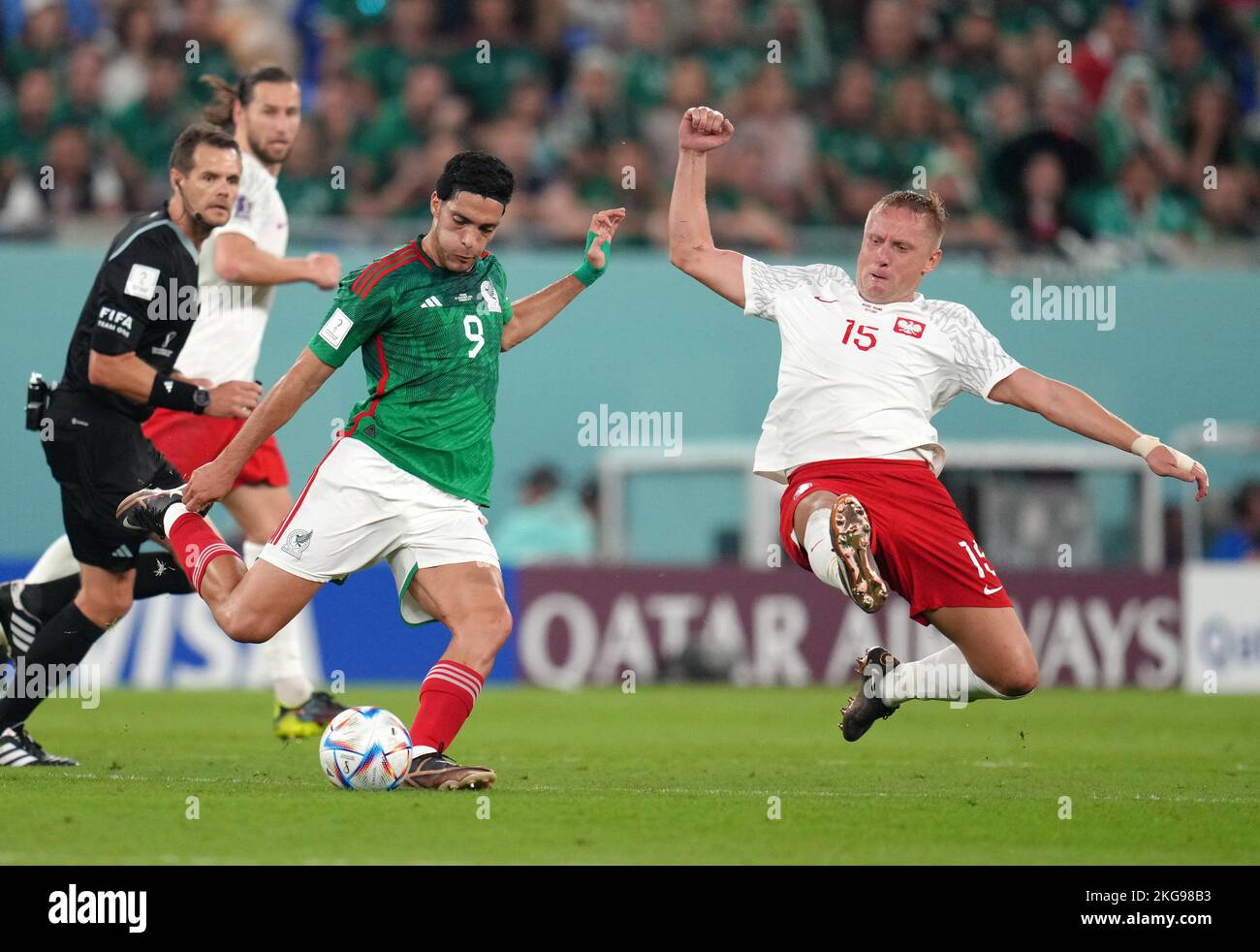 Mexico's Raul Jimenez and Poland's Kamil Glik battle for the ball during the FIFA World Cup Group C match at Stadium 974, Rass Abou Aboud. Picture date: Tuesday November 22, 2022. Stock Photo