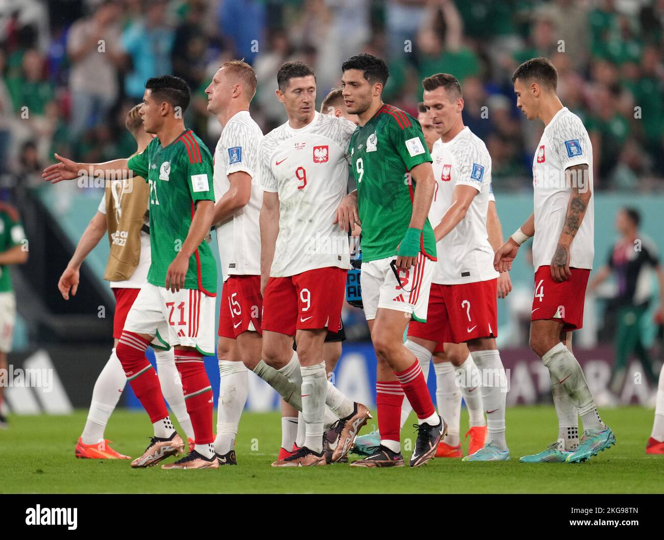 Poland's Robert Lewandowski greets Mexico's Raul Jimenez following the FIFA World Cup Group C match at Stadium 974, Rass Abou Aboud. Picture date: Tuesday November 22, 2022. Stock Photo