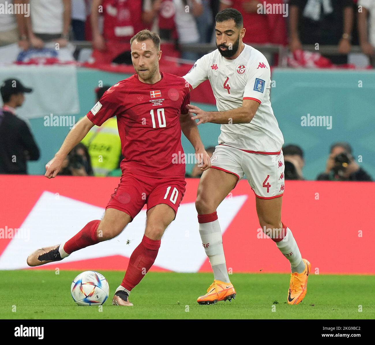 Doha, Qatar on November 22, 2022. World Cup FIFA 2022, Group D, Denmark vs Tunisia, in the picture Denmark's midfielder Christian Eriksen, Tunisia's defender Yassine Meriah Stock Photo