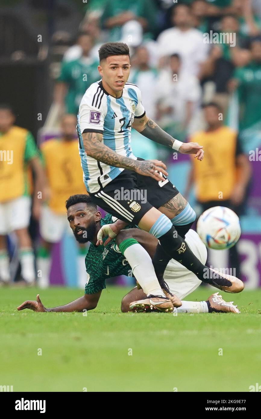 LUSAIL, QATAR - NOVEMBER 22: Player of Argentina Enzo Fernández fights for the ball with player of Saudi Arabia Feras Albrikan during the 2022 FIFA World Cup Qatar group C between Argentina and Saudi Arabia at Lusail Stadium on November 22, 2022 in Lusail, Qatar. (Photo by Florencia Tan Jun/PxImages) Stock Photo