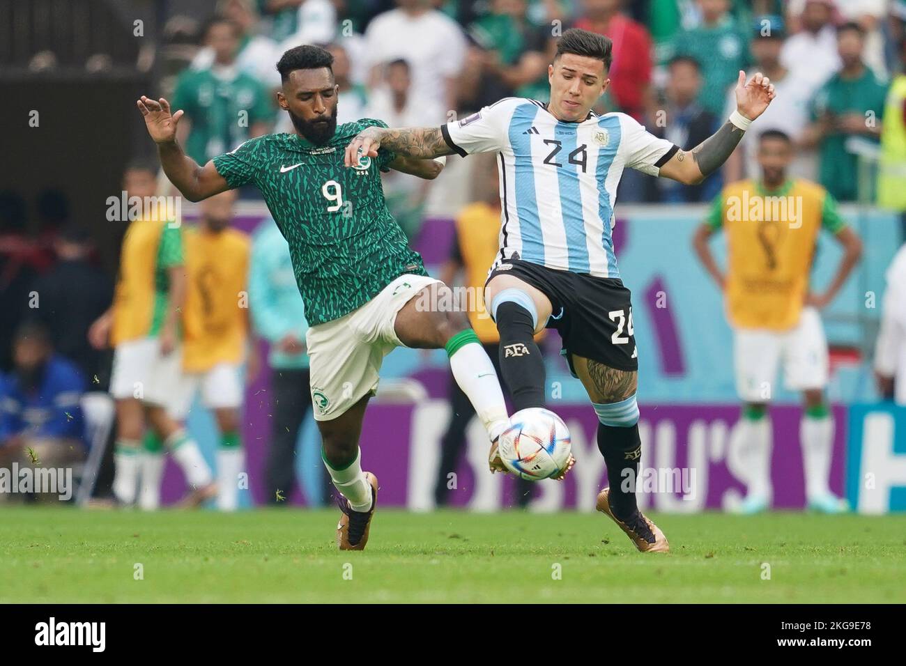 LUSAIL, QATAR - NOVEMBER 22: Player of Argentina Enzo Fernández fights for the ball with player of Saudi Arabia Feras Albrikan during the 2022 FIFA World Cup Qatar group C between Argentina and Saudi Arabia at Lusail Stadium on November 22, 2022 in Lusail, Qatar. (Photo by Florencia Tan Jun/PxImages) Stock Photo