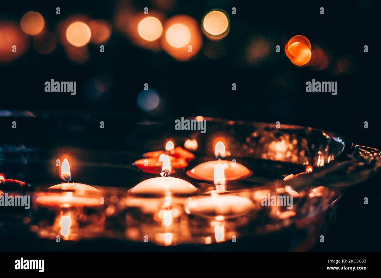 burning candles floating on water surface in dark, European christmas tradition Stock Photo Alamy