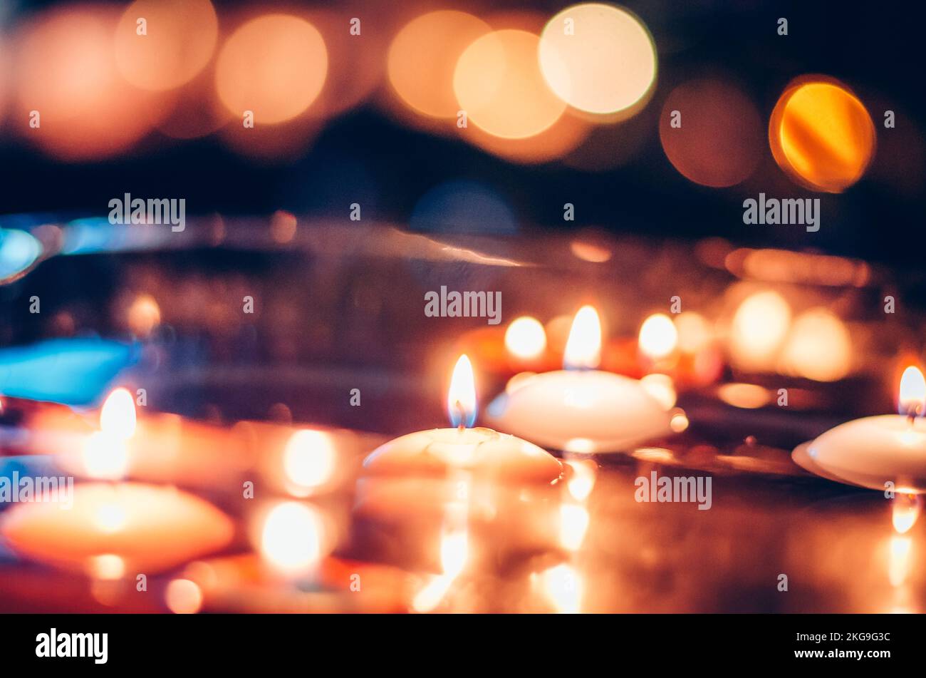burning candles floating on water surface in dark, European christmas tradition Stock Photo Alamy