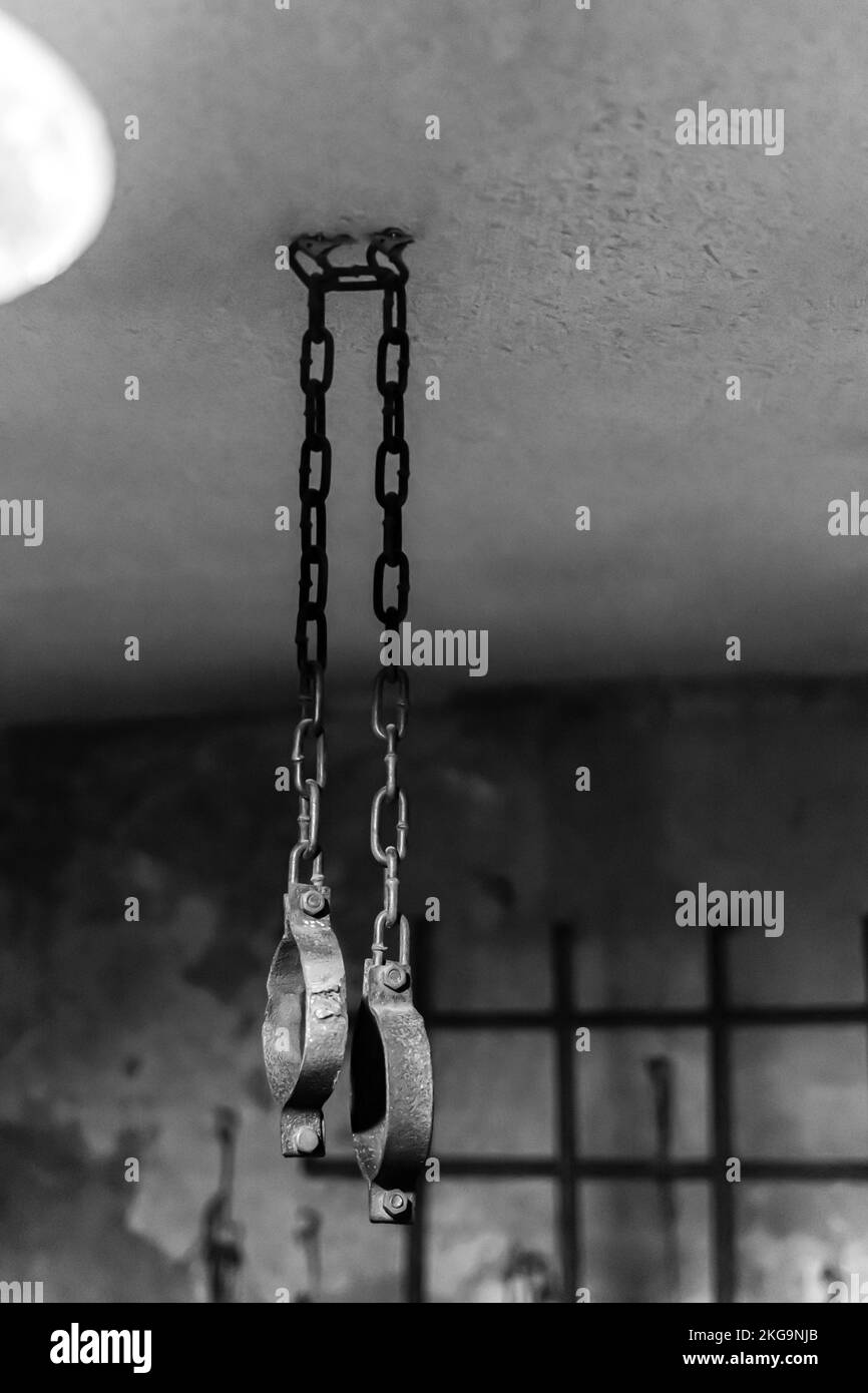 Handcuffs manacles hanging from a ceiling.  Museum KarLag, Kazakhstan Stock Photo