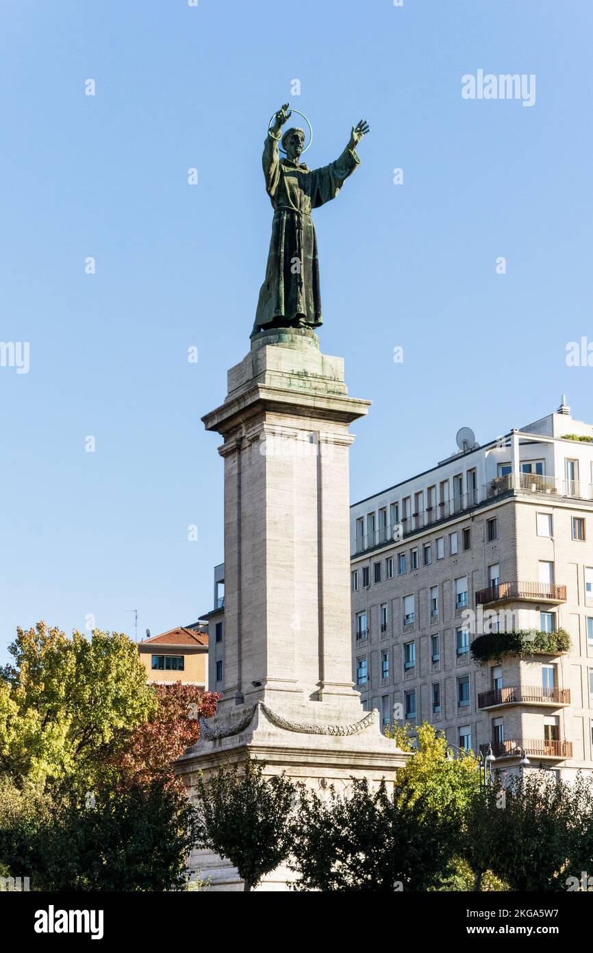 Bronze monument to St Francis of Assisi in Risorgimento Square, built in early 20th century, Milan, Lombardy region, Italy Stock Photo