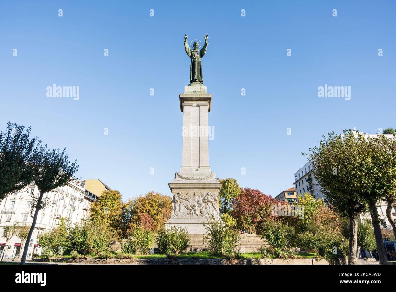 Bronze monument to St Francis of Assisi in Risorgimento Square, built in early 20th century, Milan, Lombardy region, Italy Stock Photo