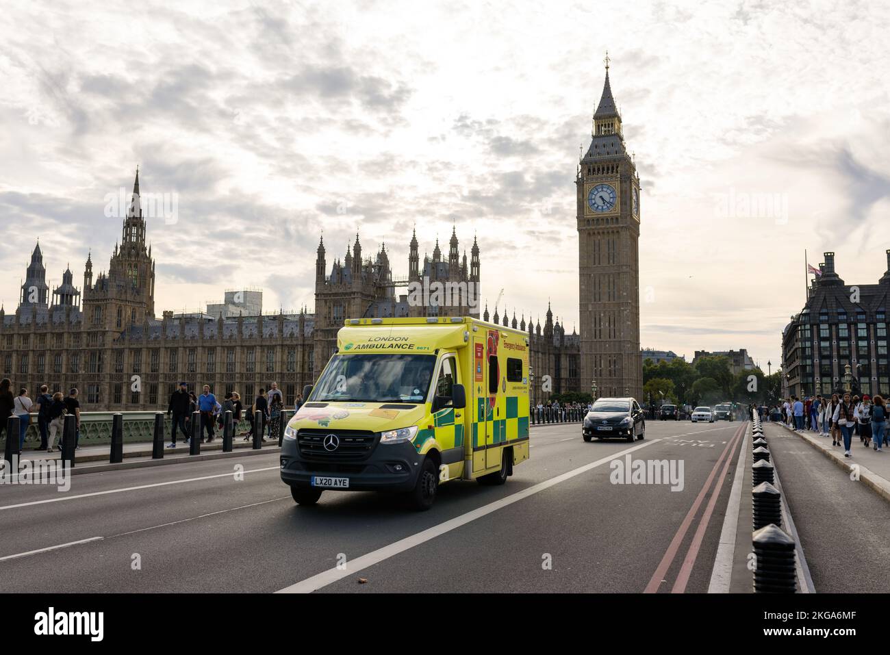 London, UK - September 11 2022 - Emergency Ambulance van speeds along a street in London near Big Ben Stock Photo