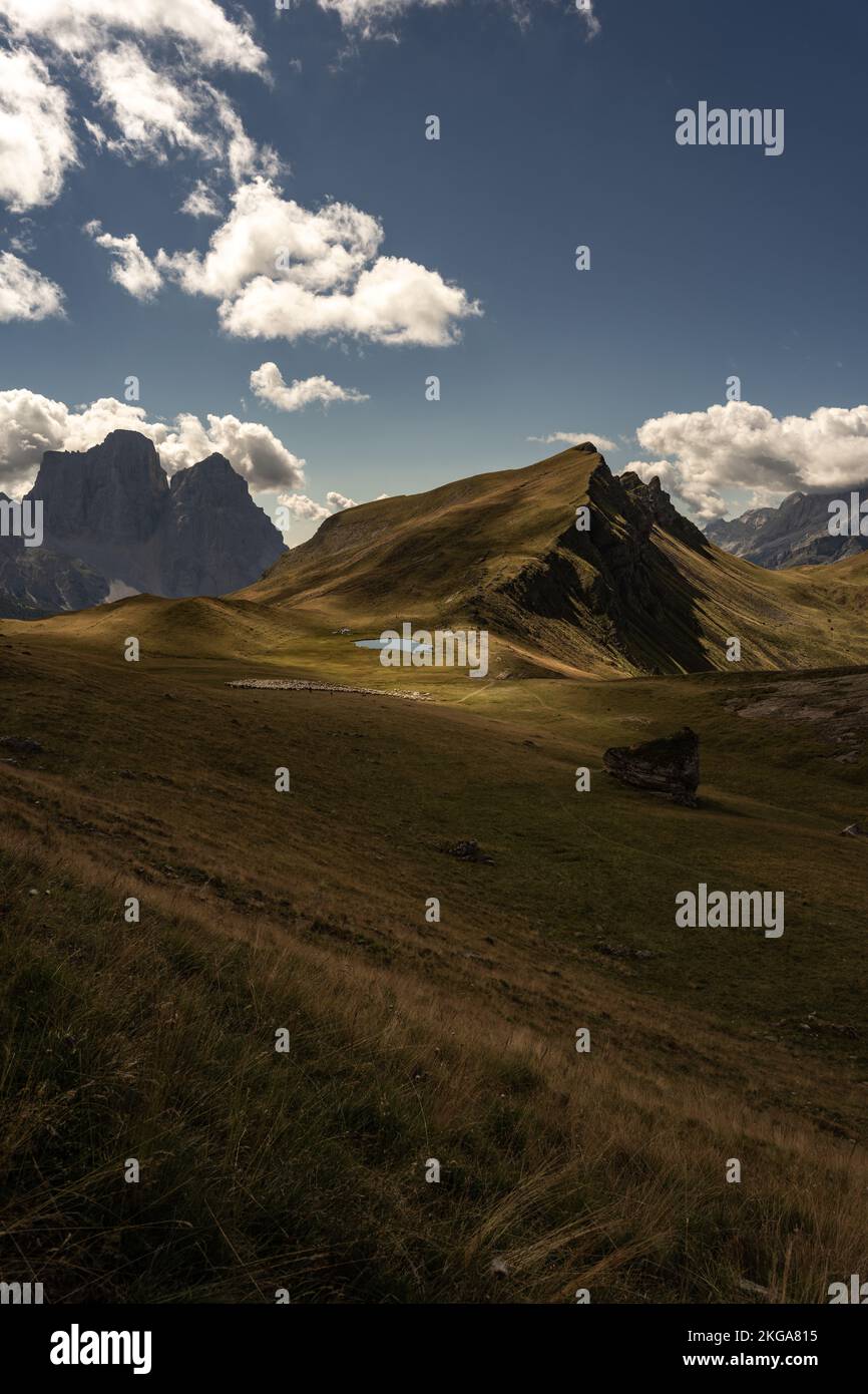 A vertical shot of scenic Dolomite Mountains in Italy covered with ...