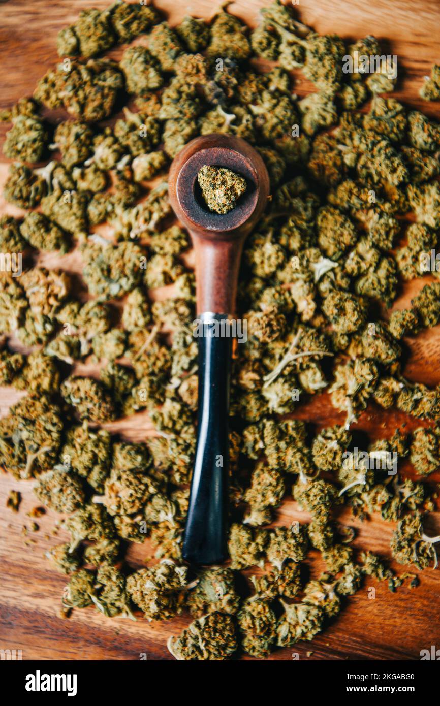 Smoking Pipe And Cannabis Leaves. Smoking Mix Of Marijuana, Medicine And  Recreational Drug. Stock Photo, Picture and Royalty Free Image. Image  124438073.