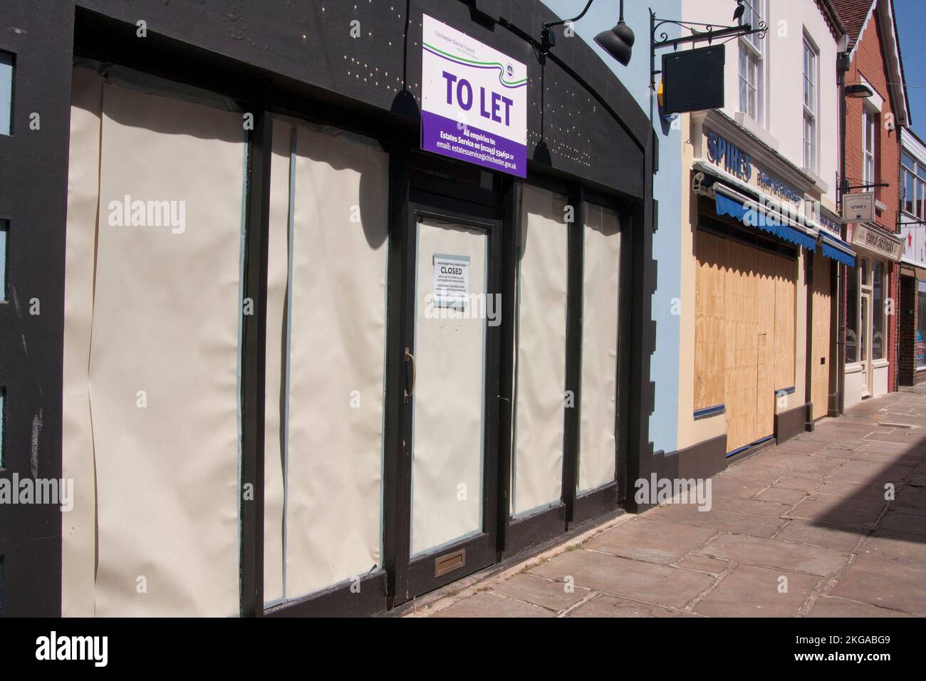 boarded up shops in Chichester city centre, West Sussex, England, the aftermath of lockdown 2020. Stock Photo