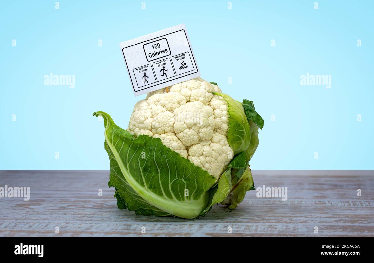 Cauliflower with exercise information label showing the amount of walking, running and swimming, needed to work off the calories eaten Stock Photo