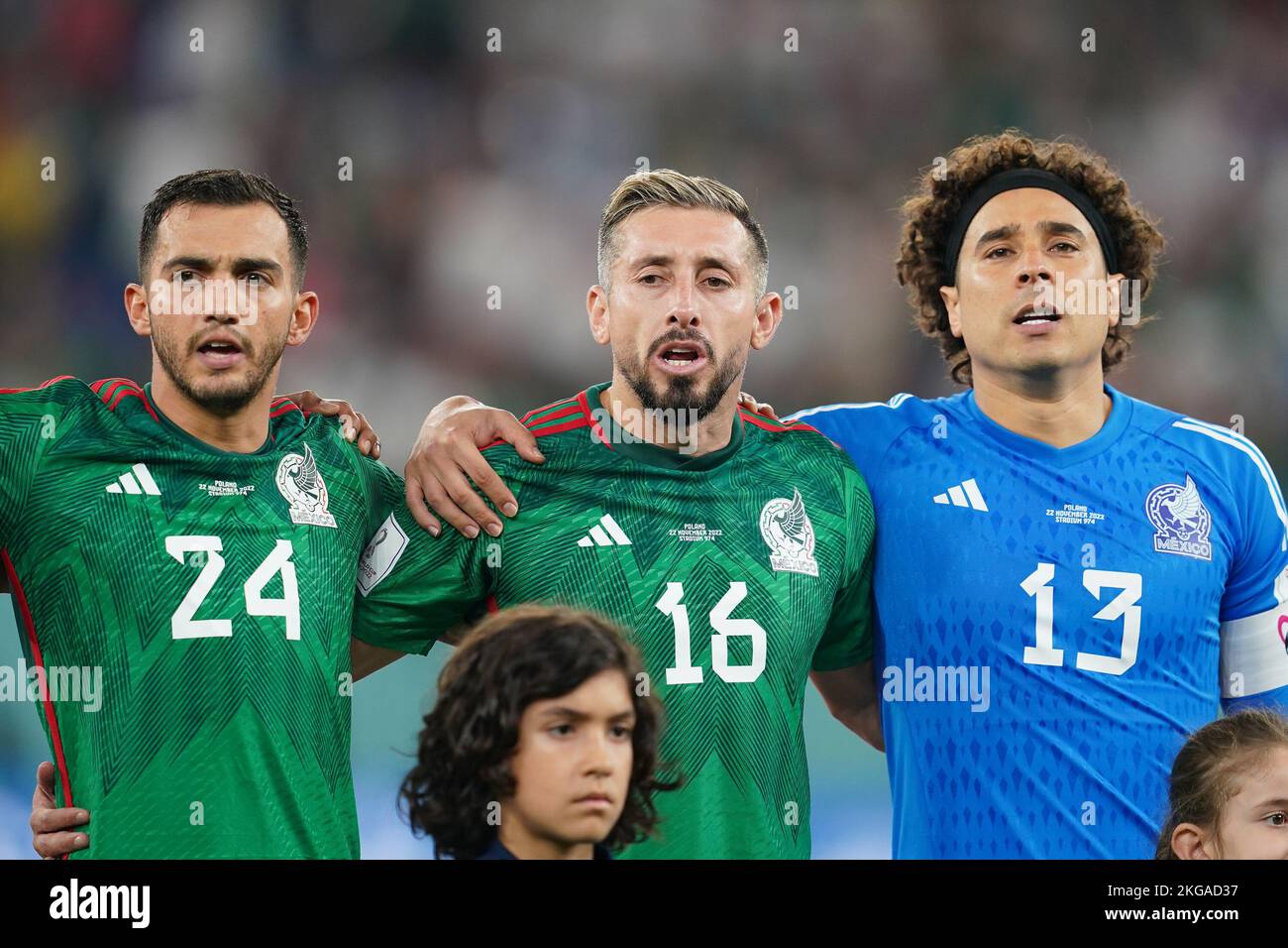 DOHA, QATAR - NOVEMBER 22: Player of Mexico Luis Chávez (24), Héctor Herrera (16), Guillermo Ochoa (13) sing the national anthem before the FIFA World Cup Qatar 2022 group C match between Mexico and Poland at Stadium 974 Stadium on November 22, 2022 in Doha, Qatar. (Photo by Florencia Tan Jun/PxImages) Stock Photo