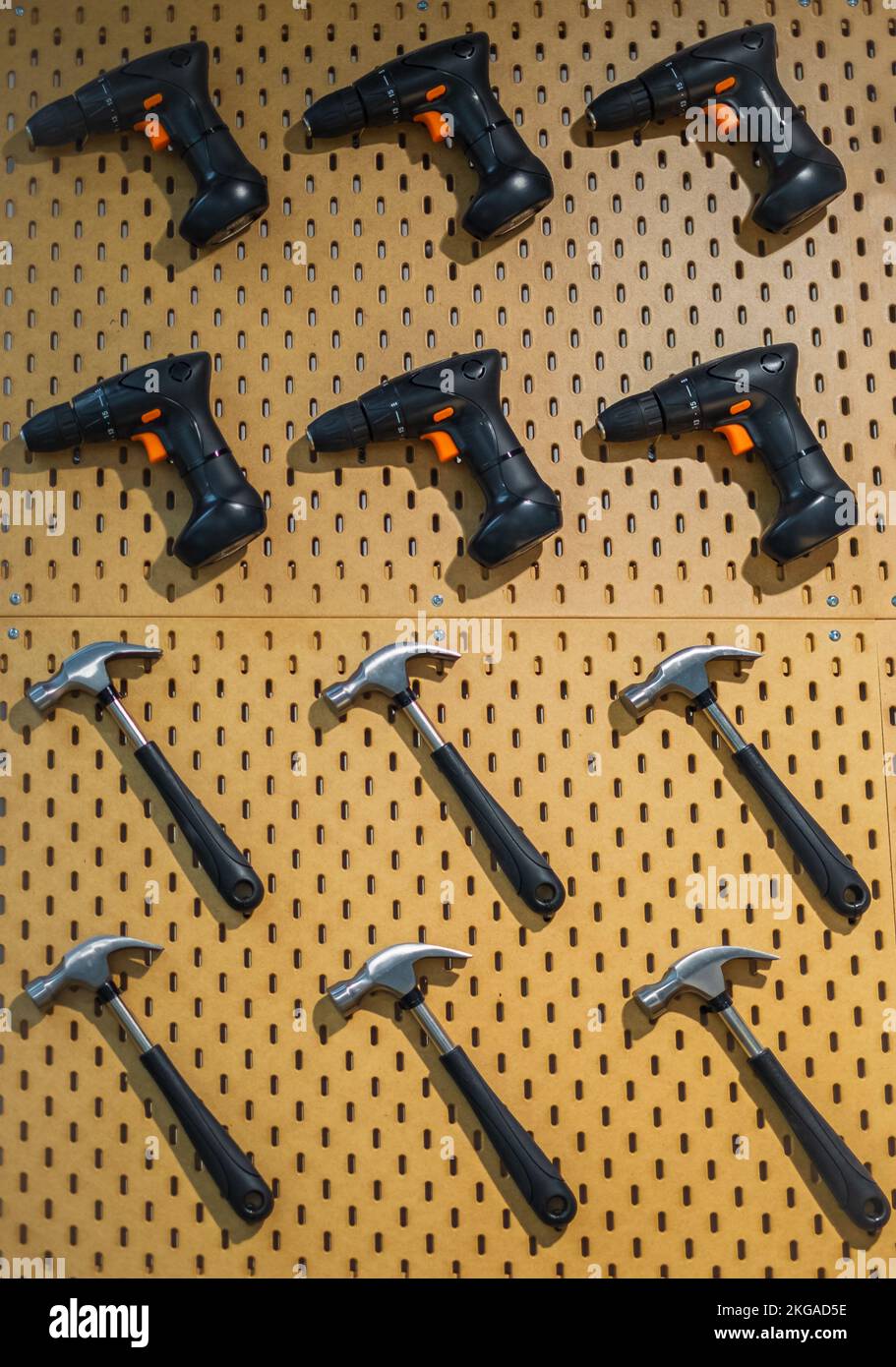 Carpentry tools hanging on the wall. Workshop scene. New tools hanging on wall in workshop, Tool on the wall, vintage garage style Stock Photo