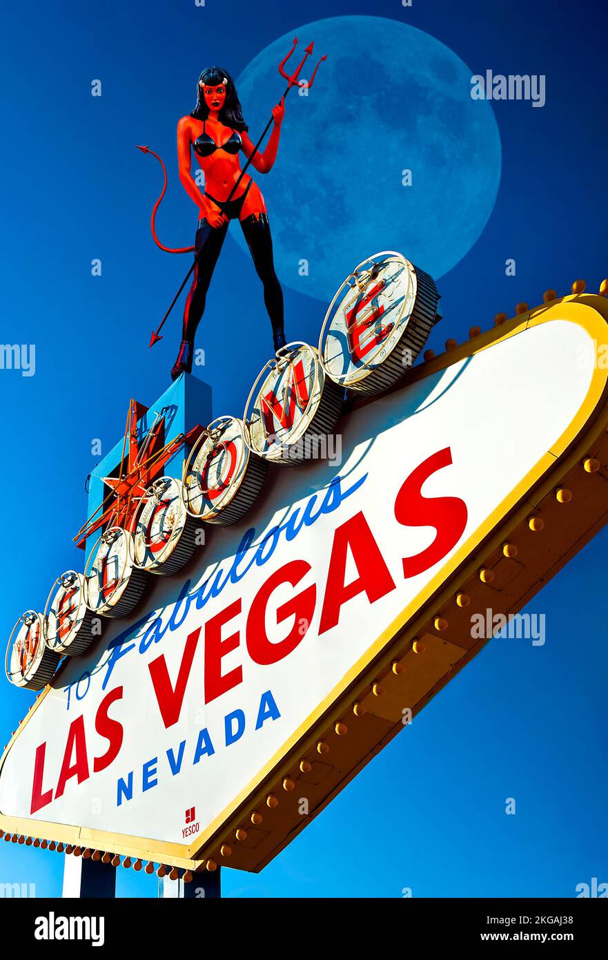 The iconic Welcome to Las Vegas Sign with a sexy Red Devil woman standing in front of a full moon Stock Photo