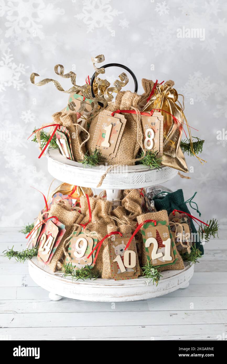 A homemade Advent calendar displayed on a two tiered stand, for the holidays. Stock Photo