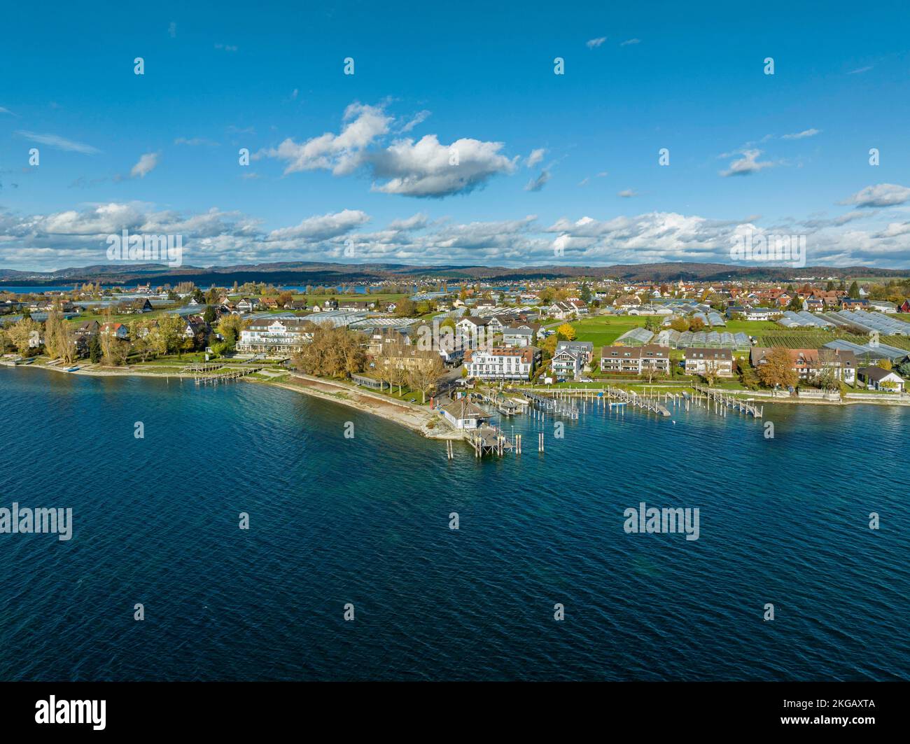 View over Lake Constance with the southern part of the island of Reichenau, on the left the traditional beach hotel Löchnerhaus, in the centre of the Stock Photo