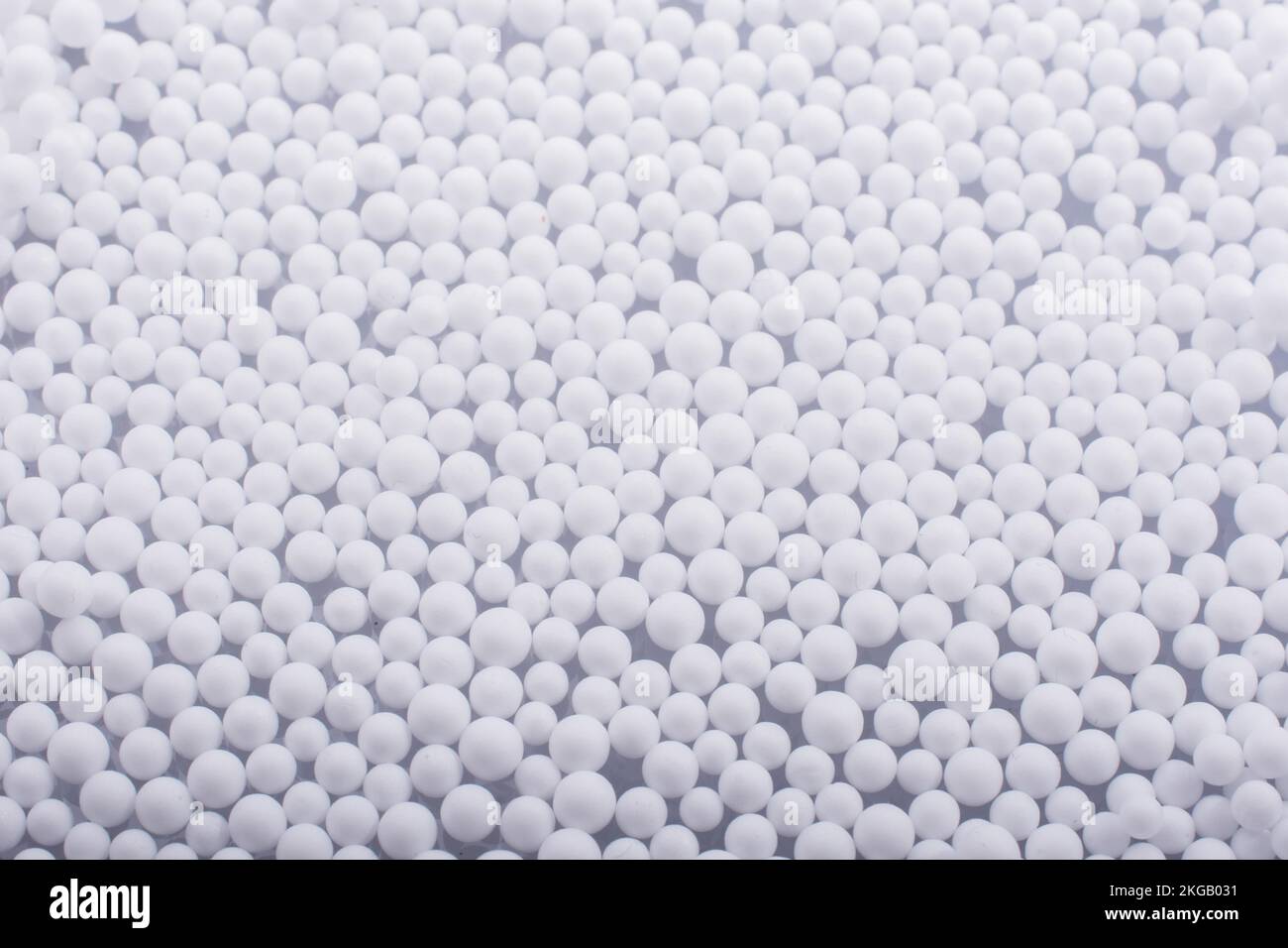 White little polystyrene foam balls as background Stock Photo - Alamy