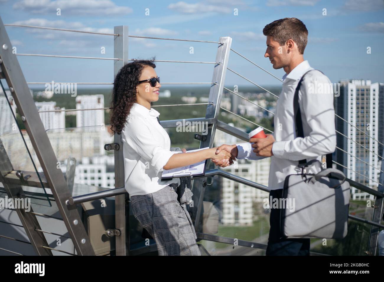 young business colleagues greet each other in the business center. Stock Photo