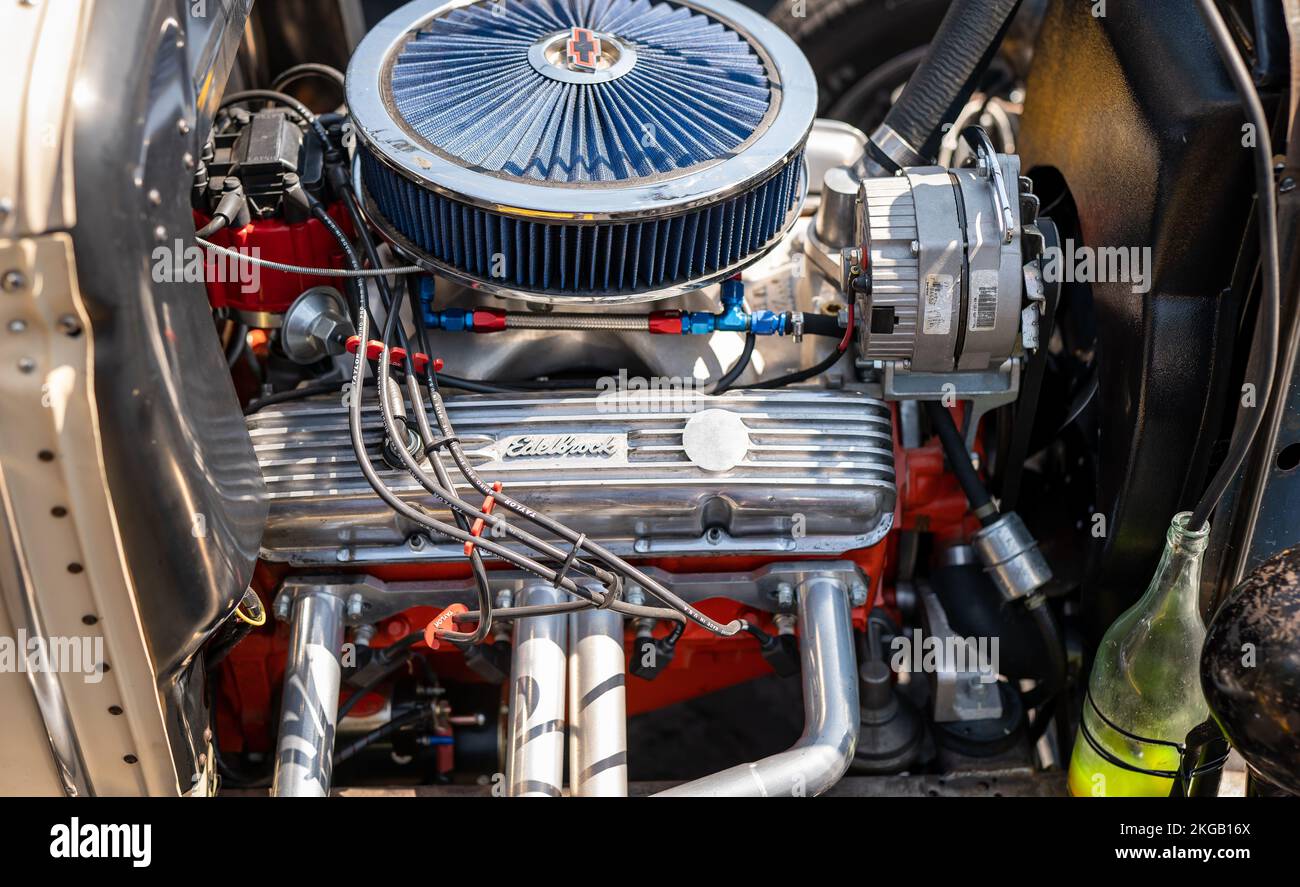 NISSWA, MN – 30 JUL 2022: Closeup image of the engine compartment of a street rod at a car show, with air filter, spark plugs, cylinder head cover and Stock Photo