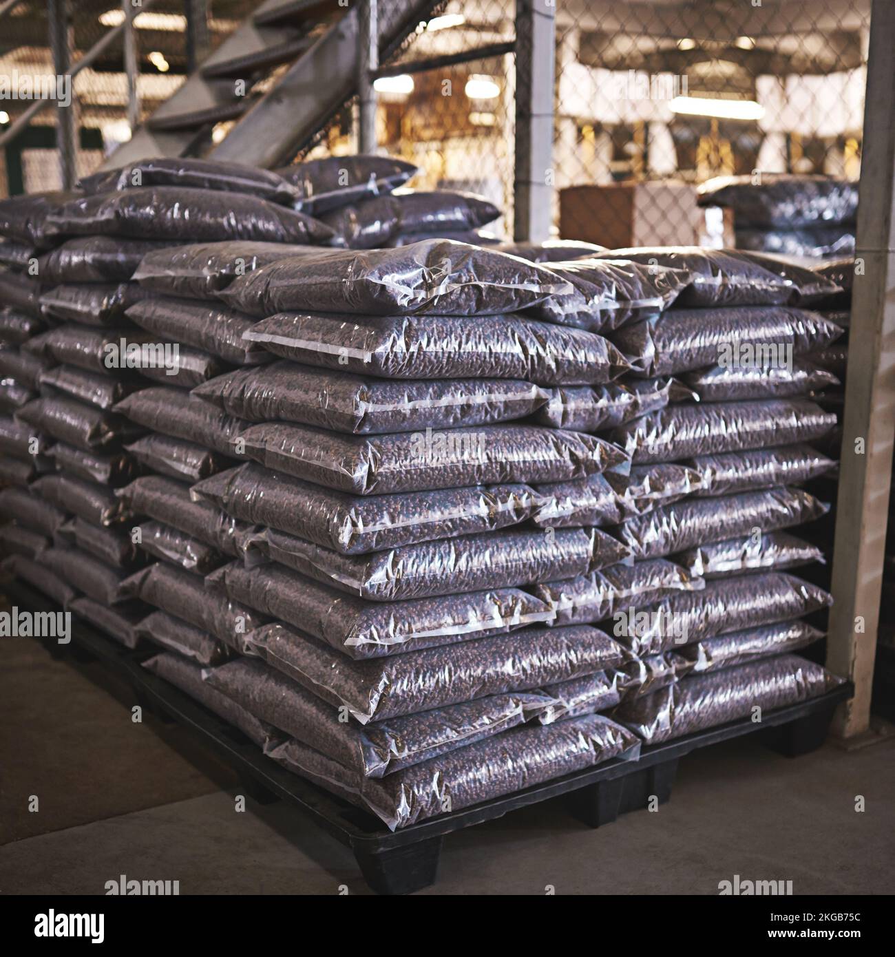 All ready for shipment. a bags of coffee beans on the floor of a